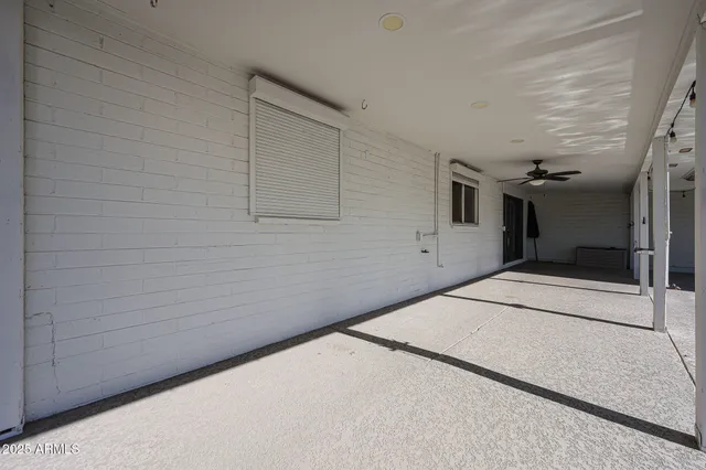 a view of a patio with couches and potted plants