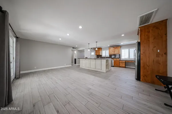 a view of kitchen and wooden floor