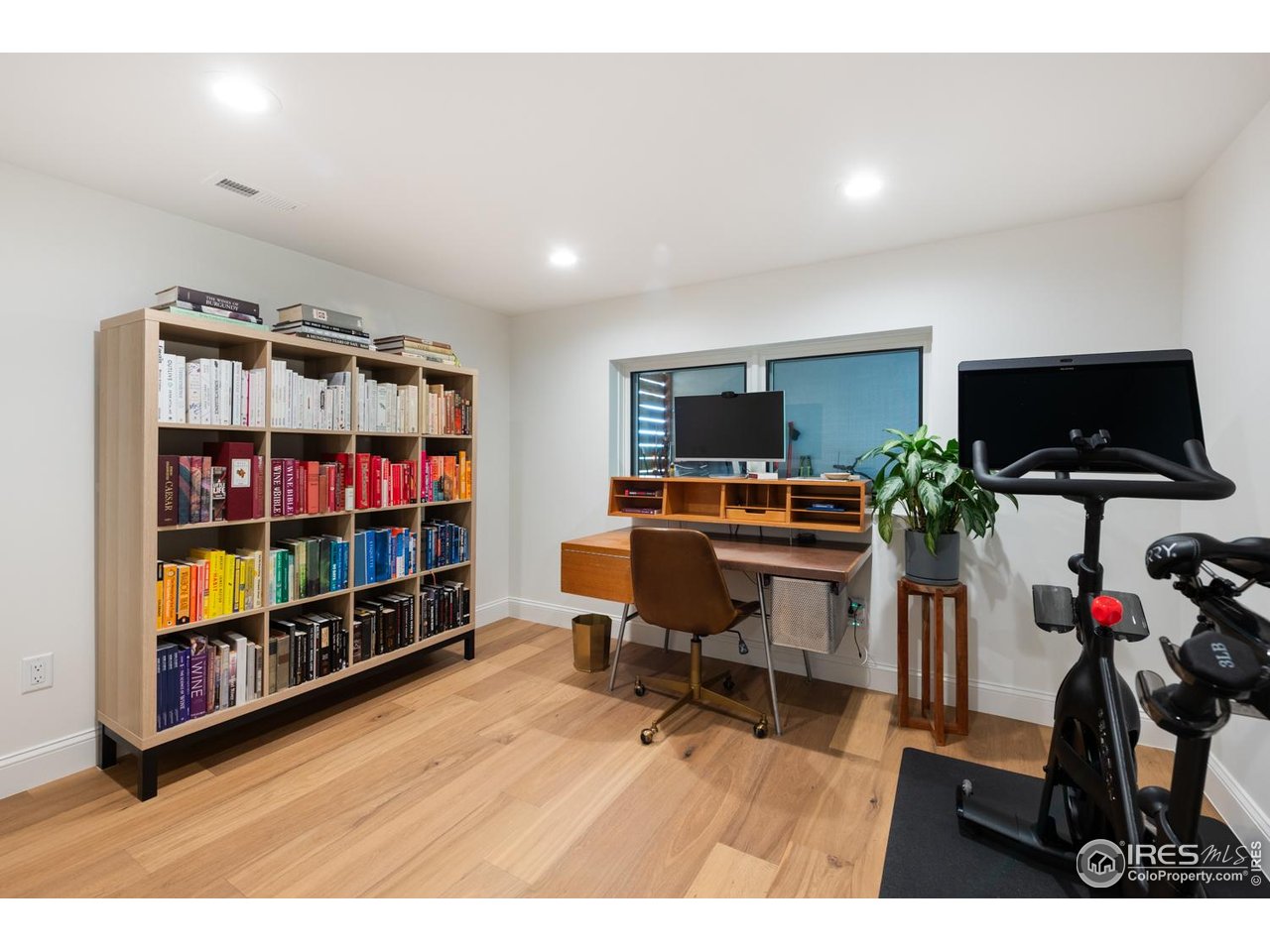 1450 High Street Boulder, CO 80304 - Photo 42 of 50 a workspace with furniture wooden floor and a flat screen tv