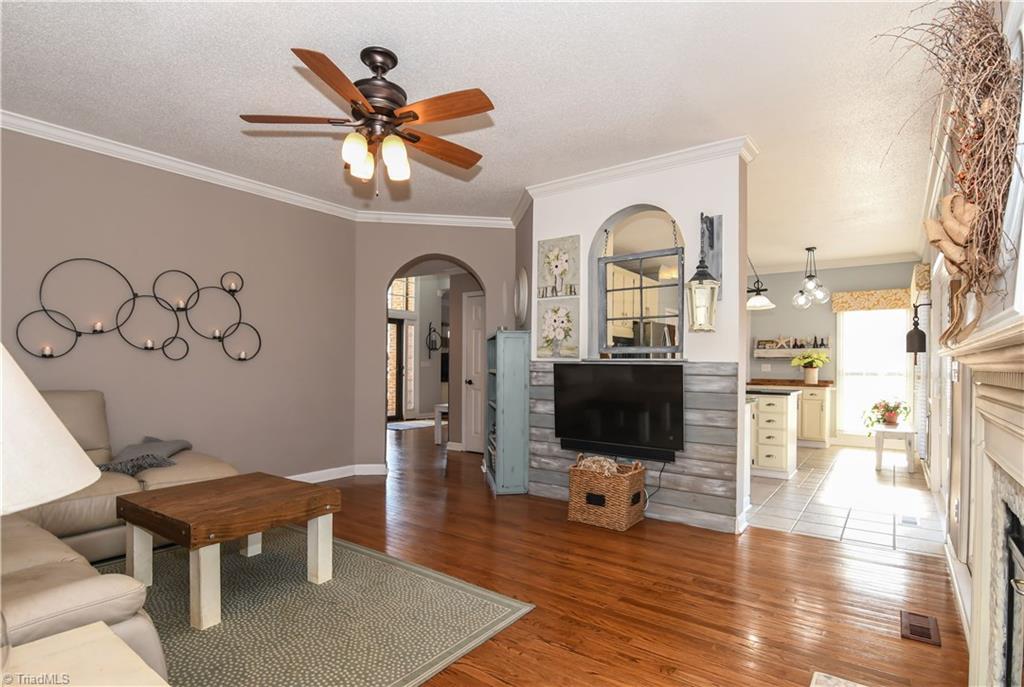 6401 High View Road Greensboro, NC 27410 - Photo 11 of 28 Den also features a ceiling fan, crown molding and easy access to the kitchen!