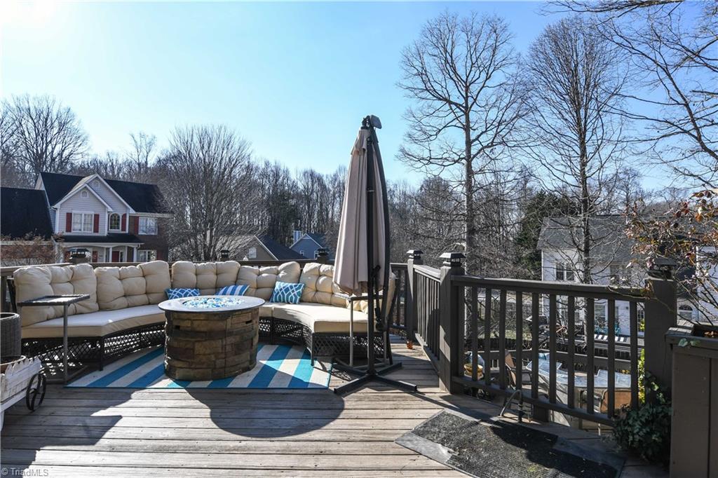6401 High View Road Greensboro, NC 27410 - Photo 22 of 28 Extensive decking in back yard provides plenty of room for entertaining!
