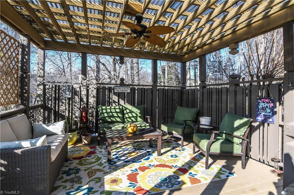 6401 High View Road Greensboro, NC 27410 - Photo 23 of 28 Covered pergola is wired with a ceiling fan for those warm summer days!