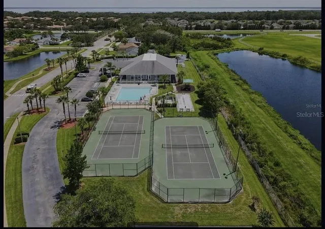 an aerial view of a house with a lake view
