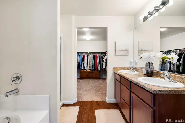 a bathroom with a sink double vanity and a mirror