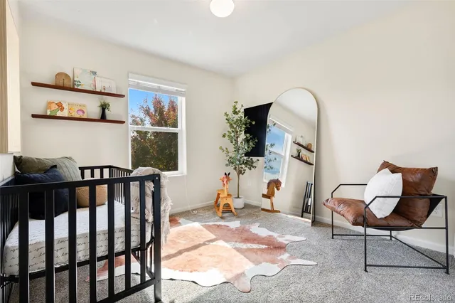 a view of a livingroom with furniture and a window