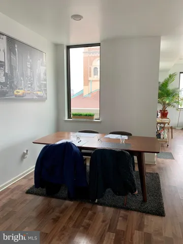 a room with a table and a window