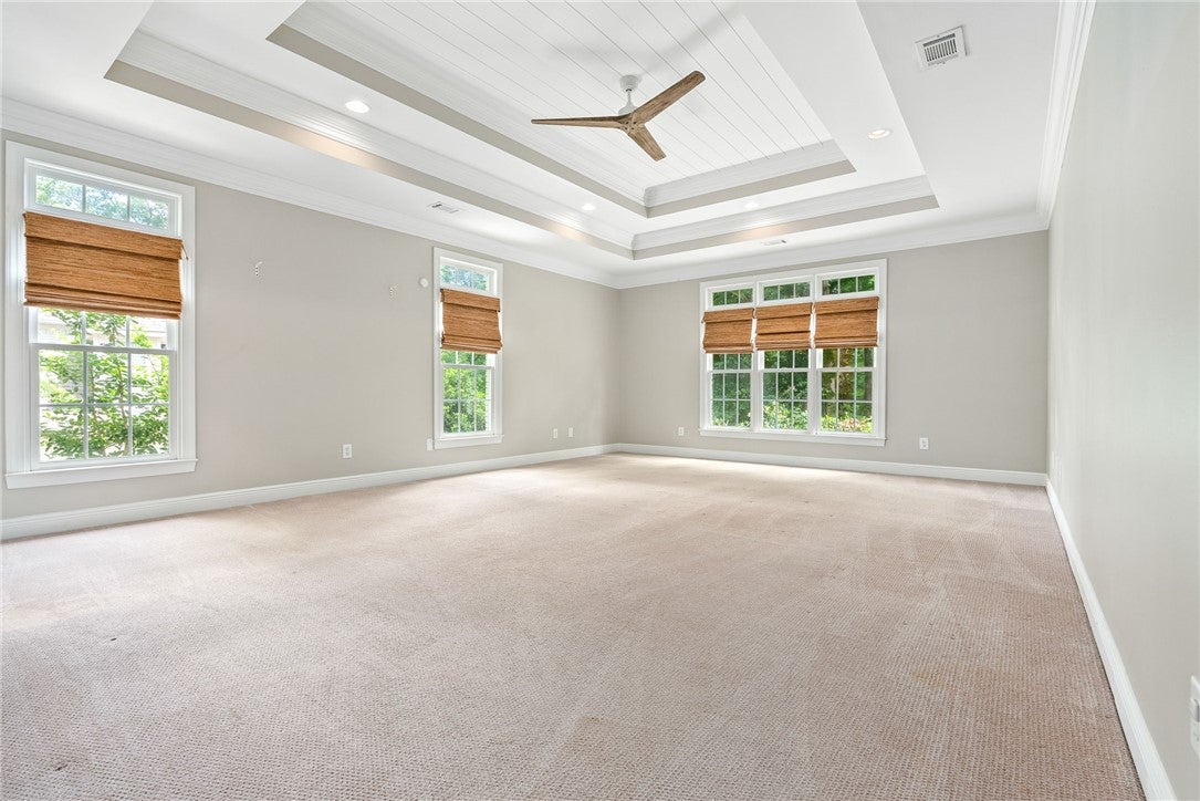 1657 Abby Road Auburn, AL 36830 - Photo 16 of 39 This spacious bedroom features a beautiful tray ceiling, recessed lighting, and ample natural light.