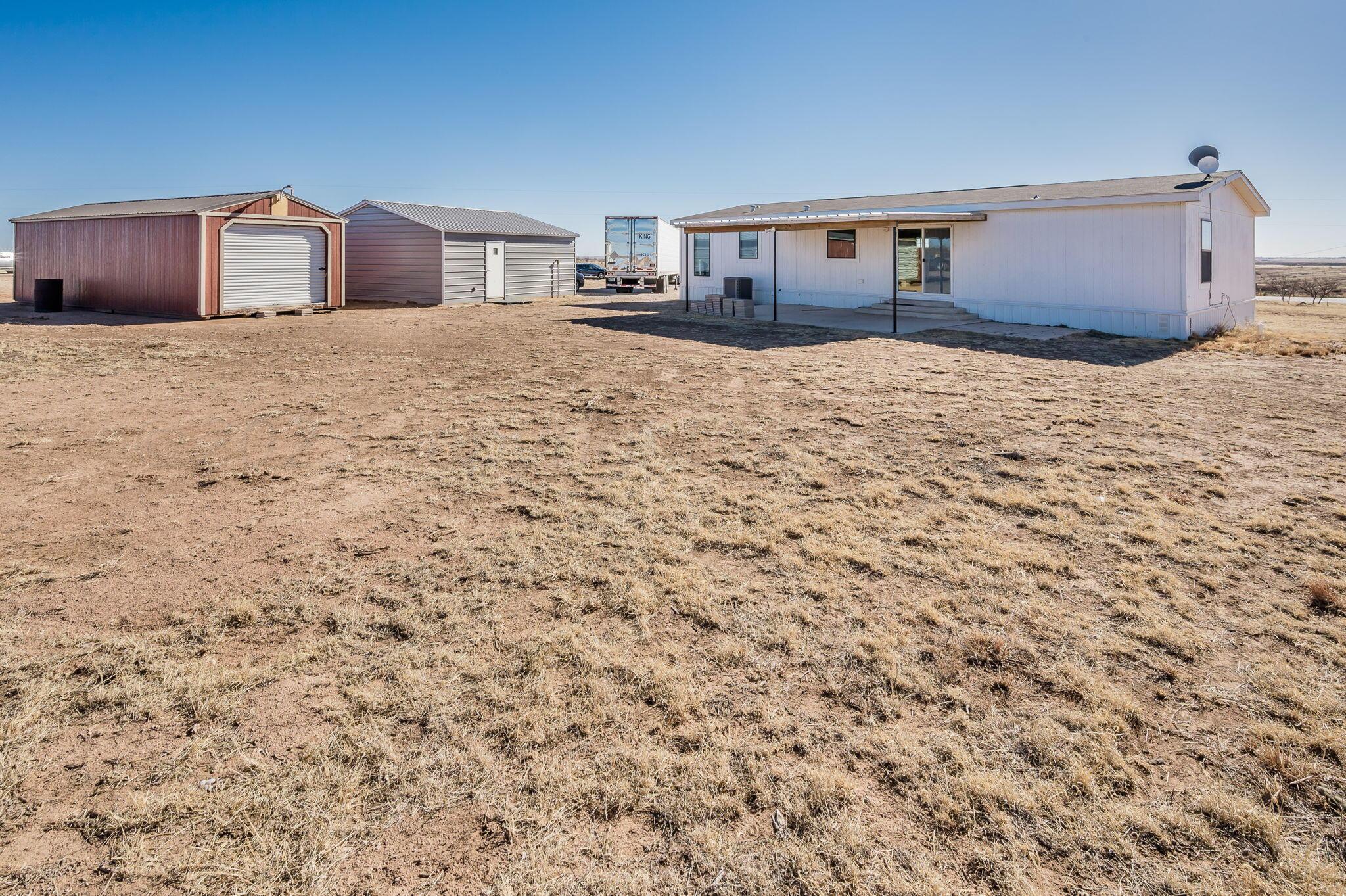3557 Estates Drive Amarillo, TX 79124 - Photo 20 of 24 a large house with a yard