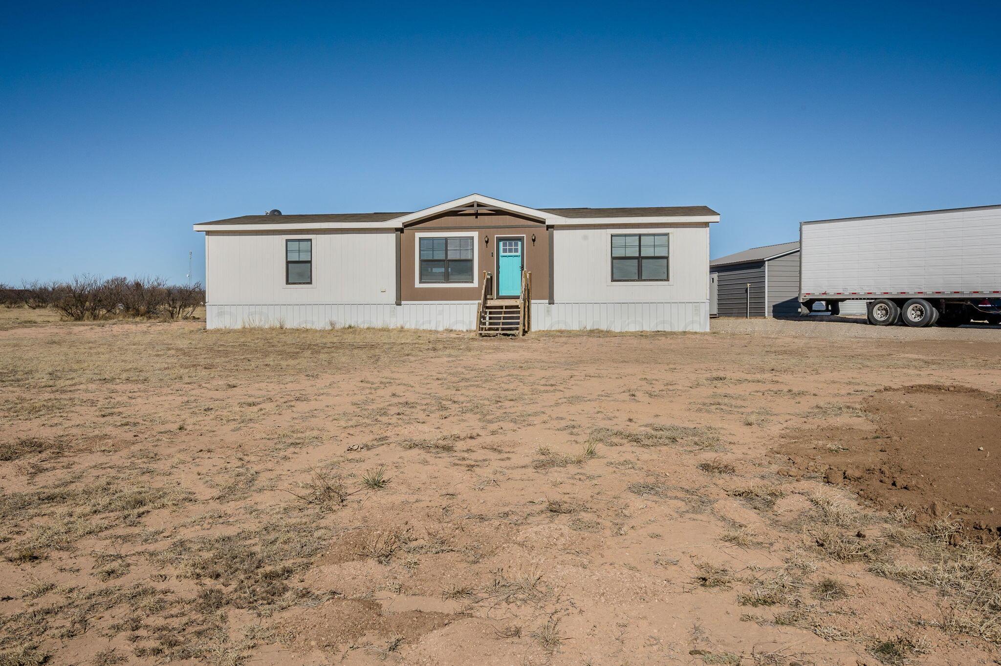 3557 Estates Drive Amarillo, TX 79124 - Photo 24 of 24 a house with trees in front of it
