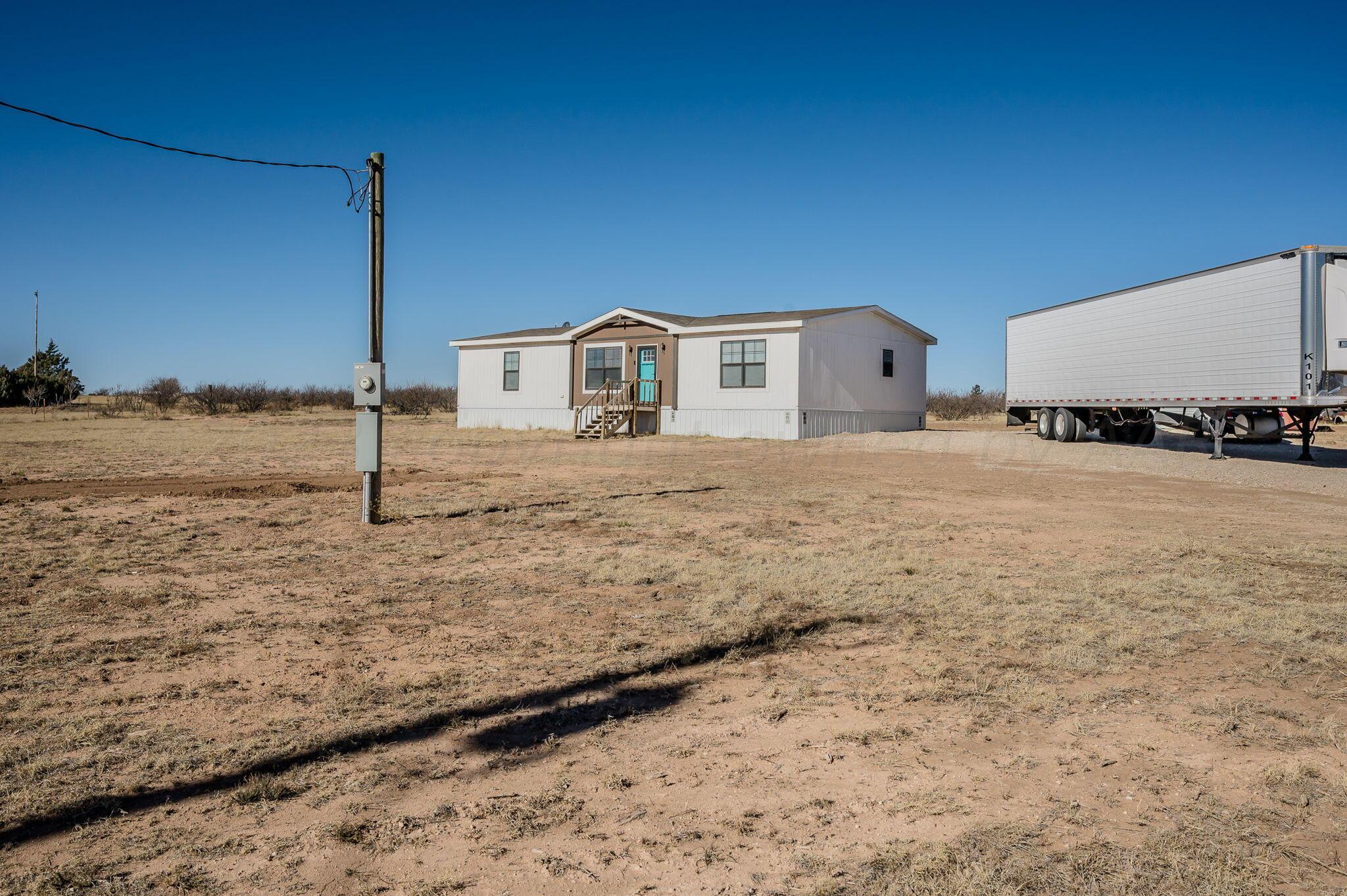 3557 Estates Drive Amarillo, TX 79124 - Photo 3 of 24 a view of a house with a yard