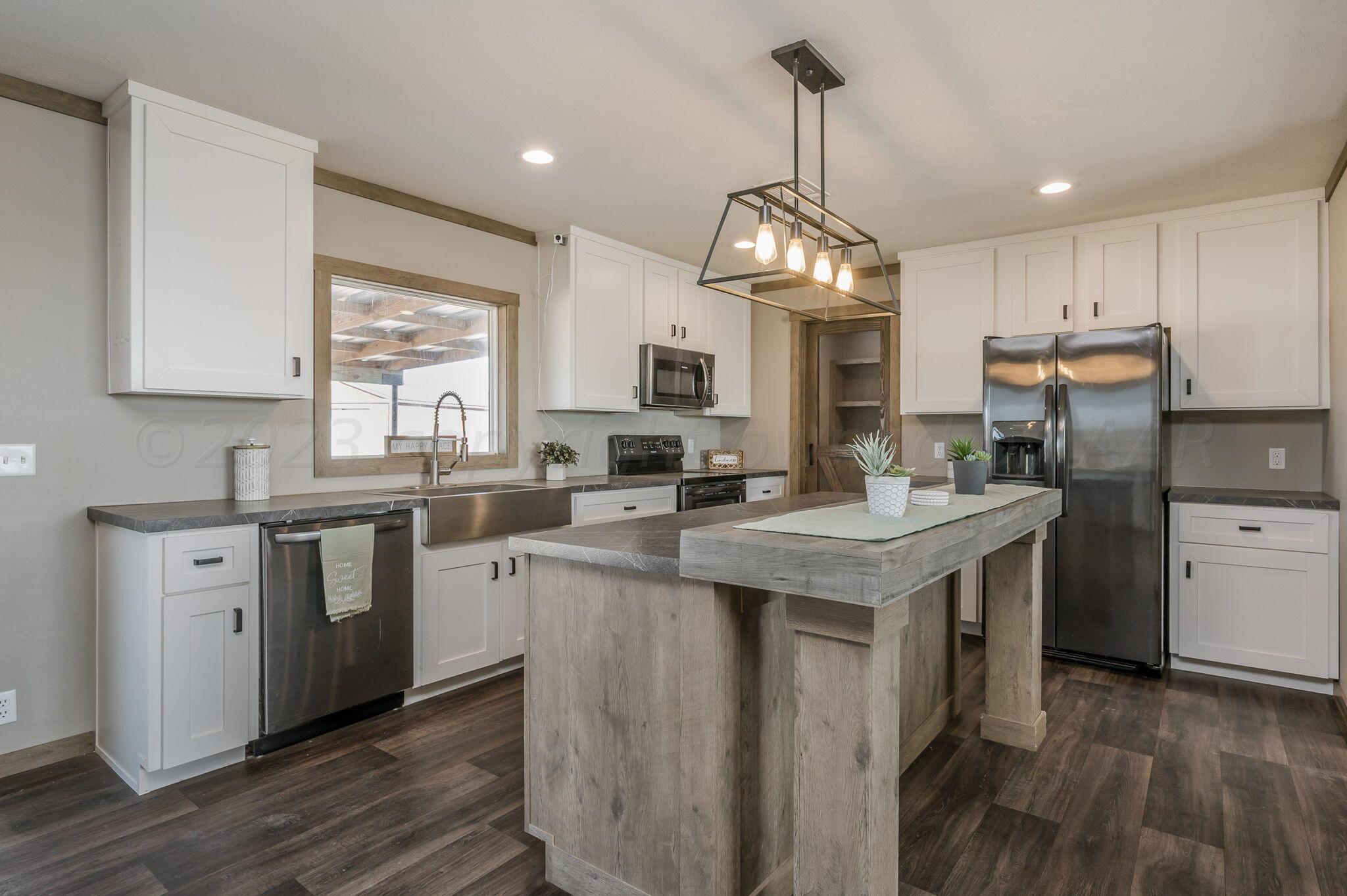 3557 Estates Drive Amarillo, TX 79124 - Photo 5 of 24 a kitchen with sink stove and refrigerator