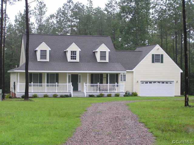 25766 Baugh Road Carson, VA 23830 - Photo 1 of 1 a view of an house with backyard space and garden