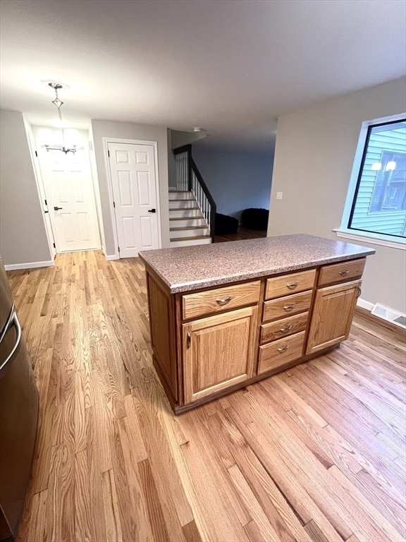 123 Chapin Road, Unit 1A4 Hudson, MA 01749 - Photo 14 of 32 a living room with wooden floors and a wooden floors