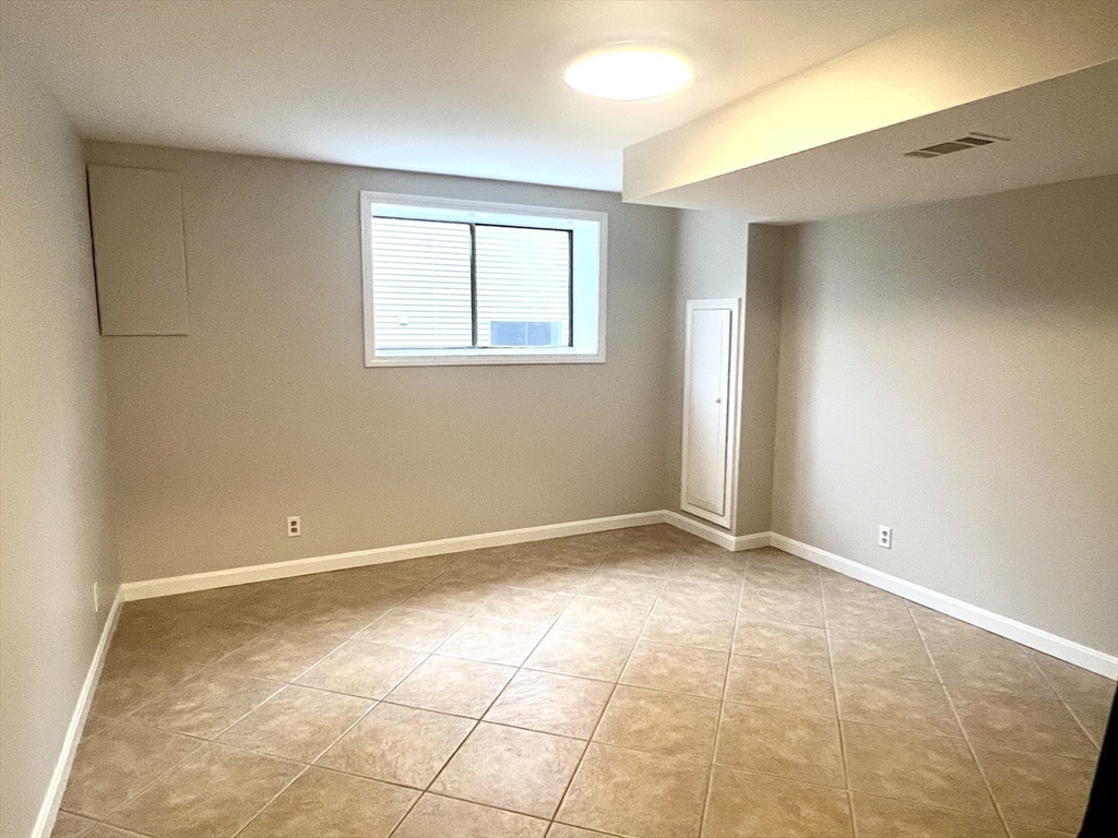 123 Chapin Road, Unit 1A4 Hudson, MA 01749 - Photo 26 of 32 a view of an empty room with a window