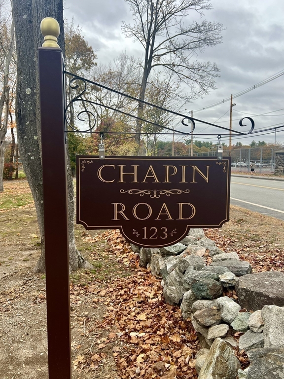 123 Chapin Road, Unit 1A4 Hudson, MA 01749 - Photo 3 of 32 a street sign on a brick wall