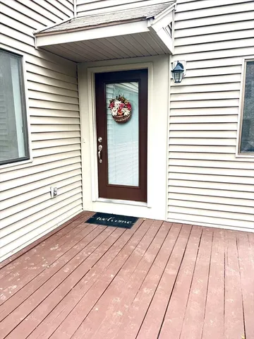 a view of a wooden door of the house