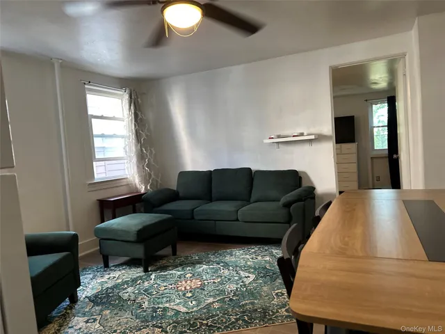 a living room with a couch and a table