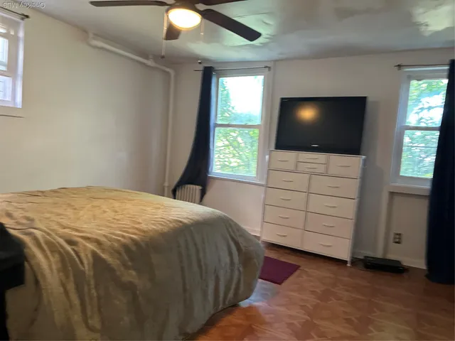 a bedroom with a bed and closet