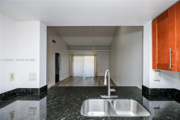 a kitchen with a sink and a window