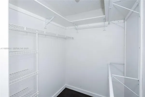 a view of an empty walk in closet