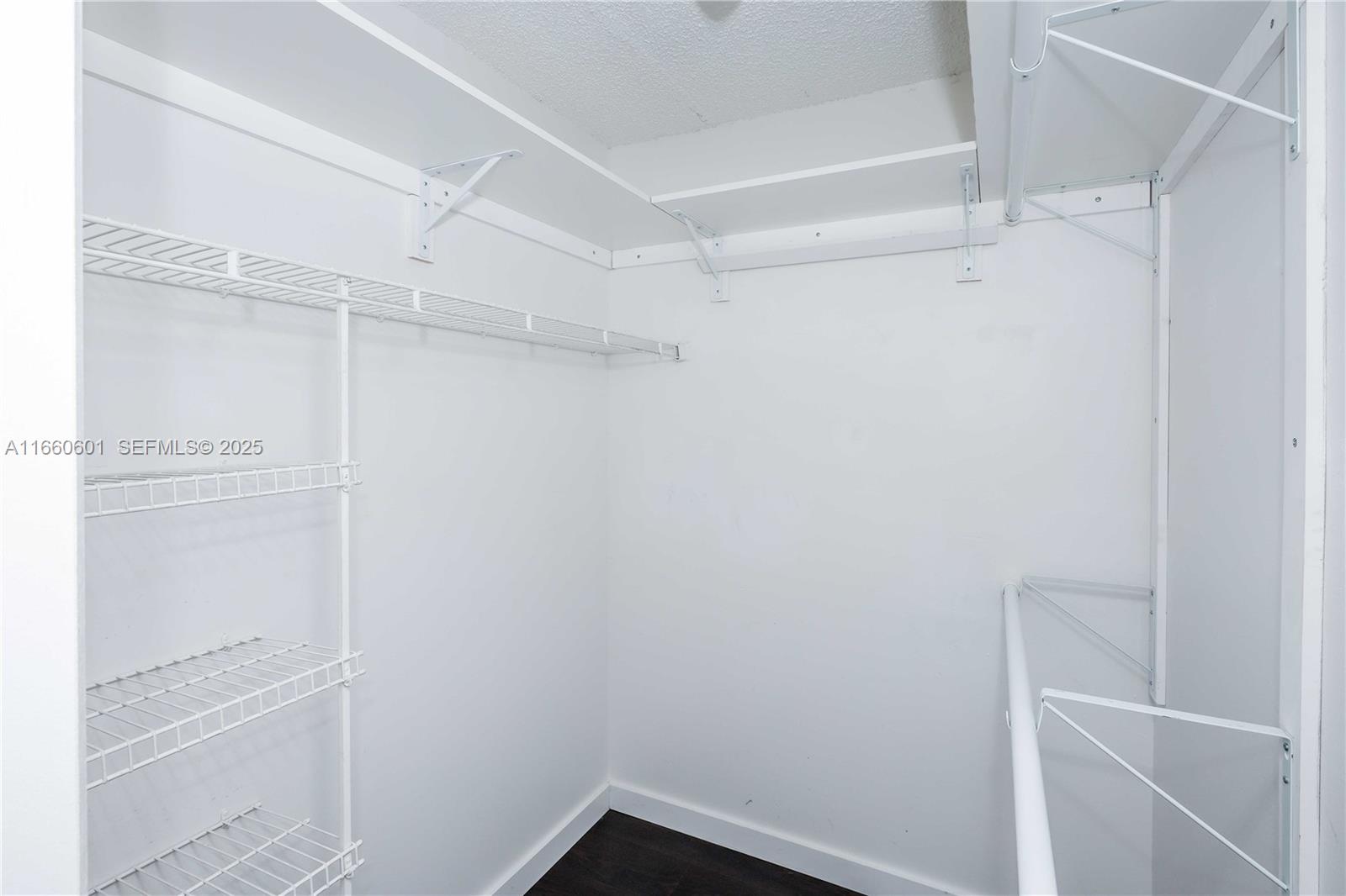 446 Southwest 113th Way, Unit 446 Pembroke Pines, FL 33025 - Photo 14 of 39 a view of an empty walk in closet