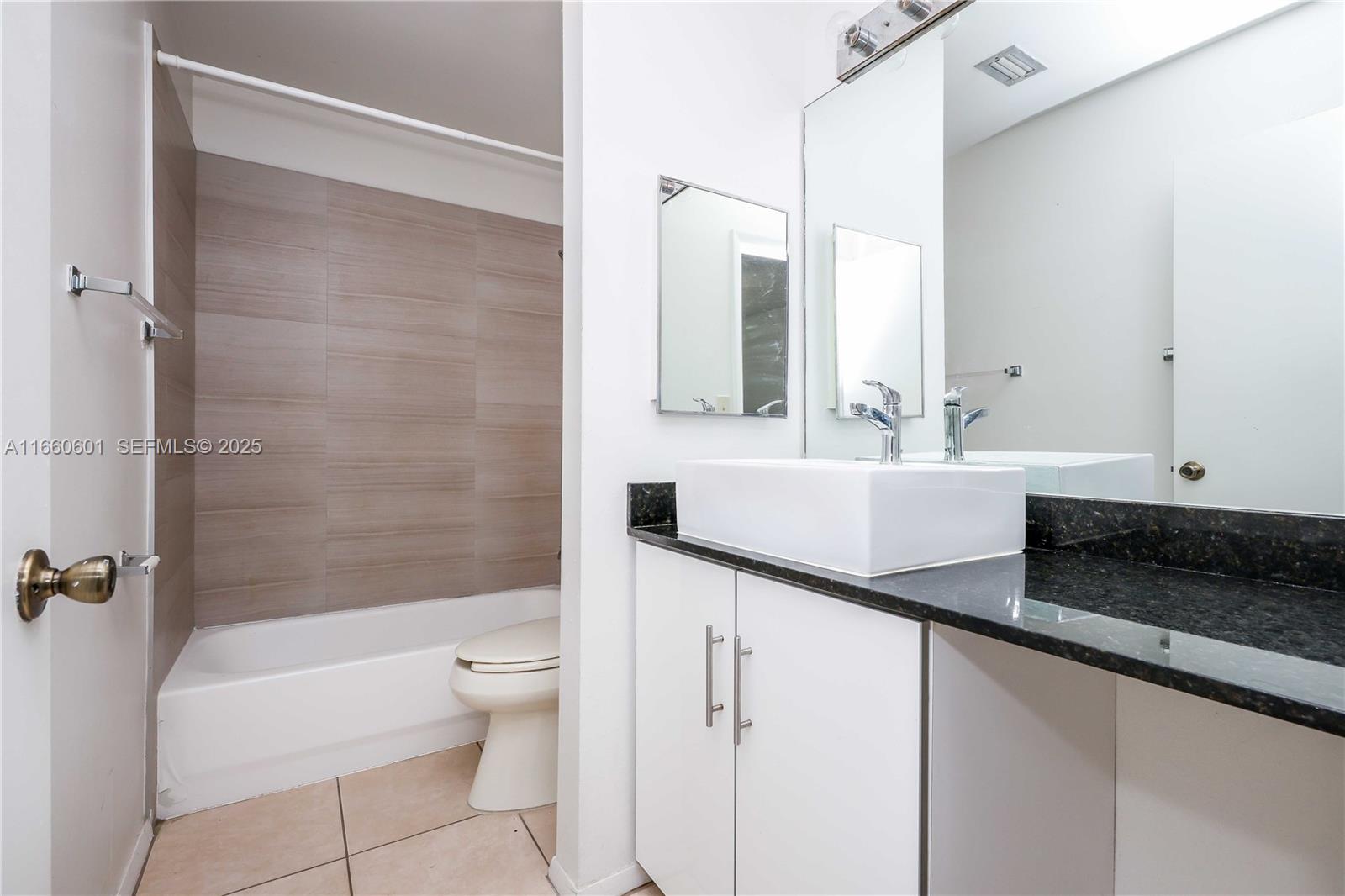 446 Southwest 113th Way, Unit 446 Pembroke Pines, FL 33025 - Photo 15 of 39 a bathroom with a sink a toilet and a bathtub