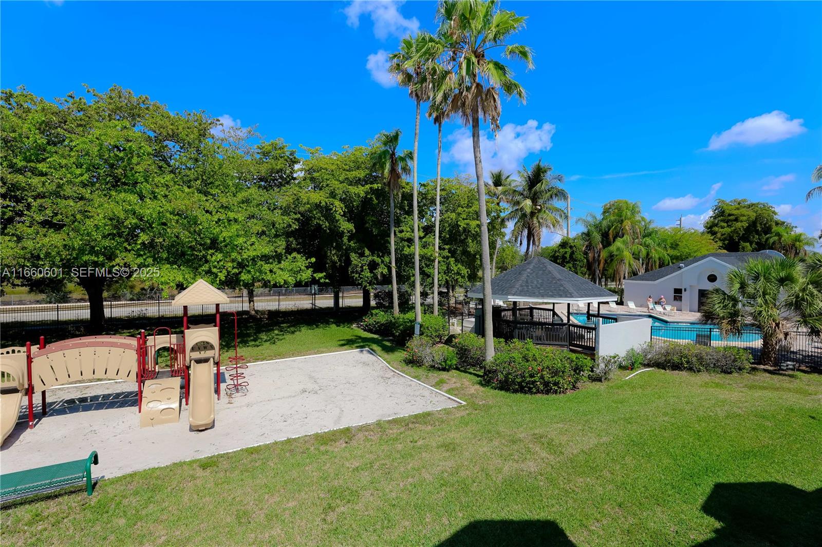 446 Southwest 113th Way, Unit 446 Pembroke Pines, FL 33025 - Photo 26 of 39 a garden view with a seating space