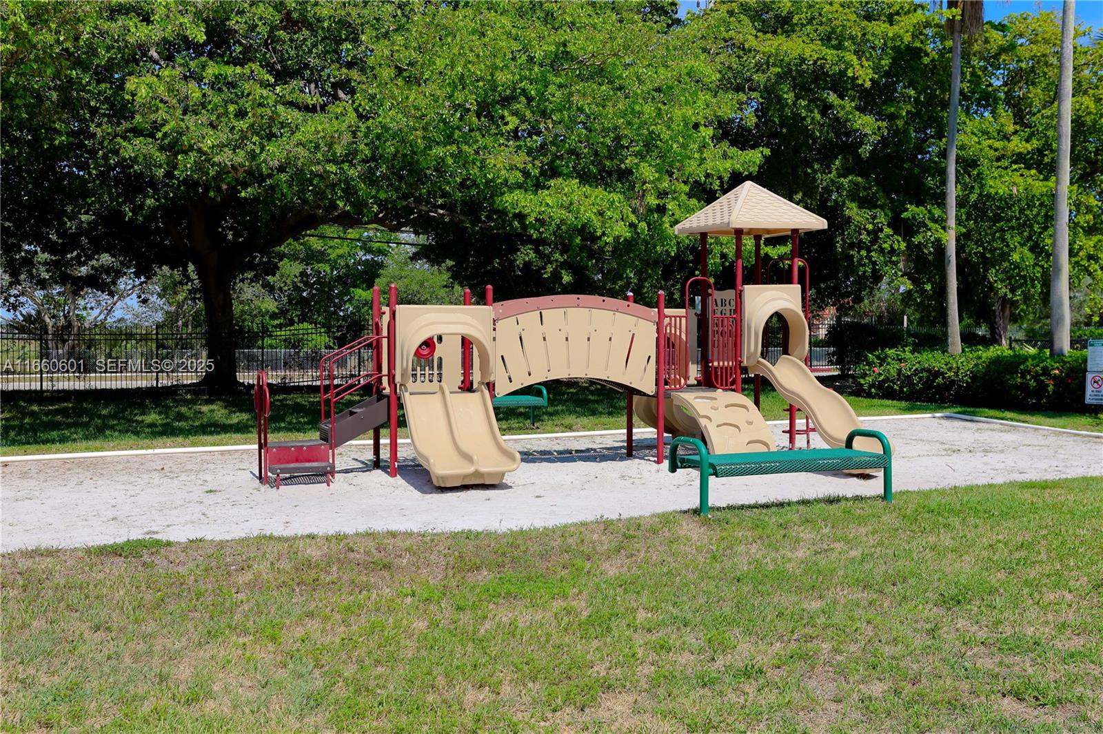 446 Southwest 113th Way, Unit 446 Pembroke Pines, FL 33025 - Photo 28 of 39 a park view with a bench and trees