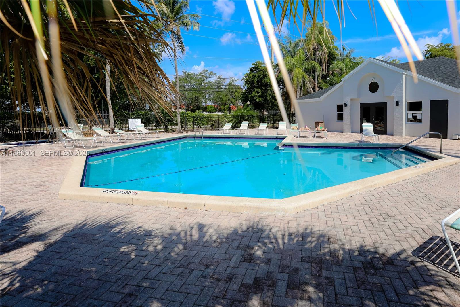 446 Southwest 113th Way, Unit 446 Pembroke Pines, FL 33025 - Photo 32 of 39 a view of swimming pool with a yard