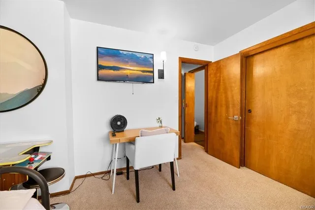 a workspace with furniture and a window