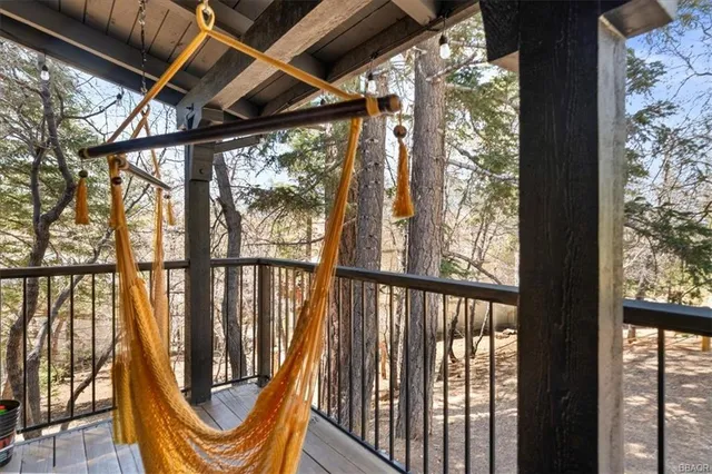 a view of a porch with wooden floor