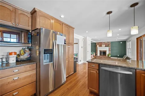 a kitchen with granite countertop a sink and a window
