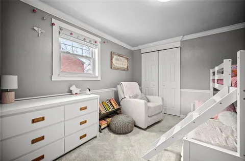 a bedroom with furniture and a white walls