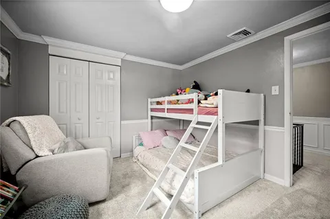 a bedroom with furniture and a window