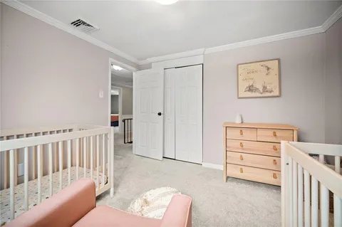 a bathroom with a granite countertop toilet a sink and a mirror