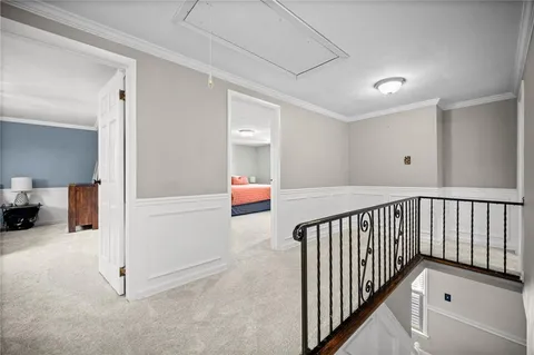 a bedroom with a large bed and a flat screen tv