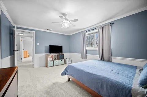 a bedroom with a bed and closet