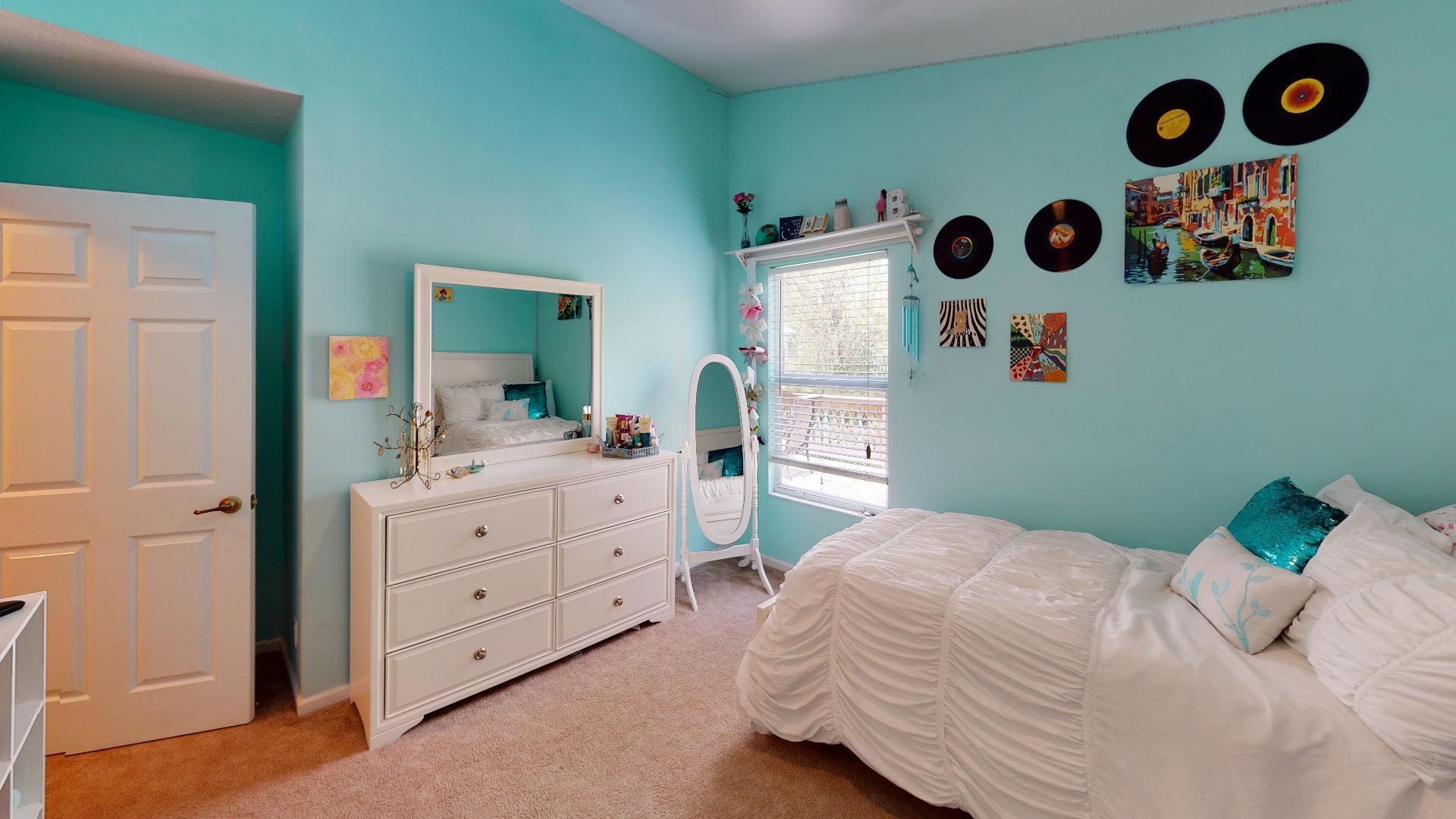 150 Sunshine Boulevard Tavernier, FL 33070 - Photo 12 of 26 a bedroom with a bed and a dresser in it