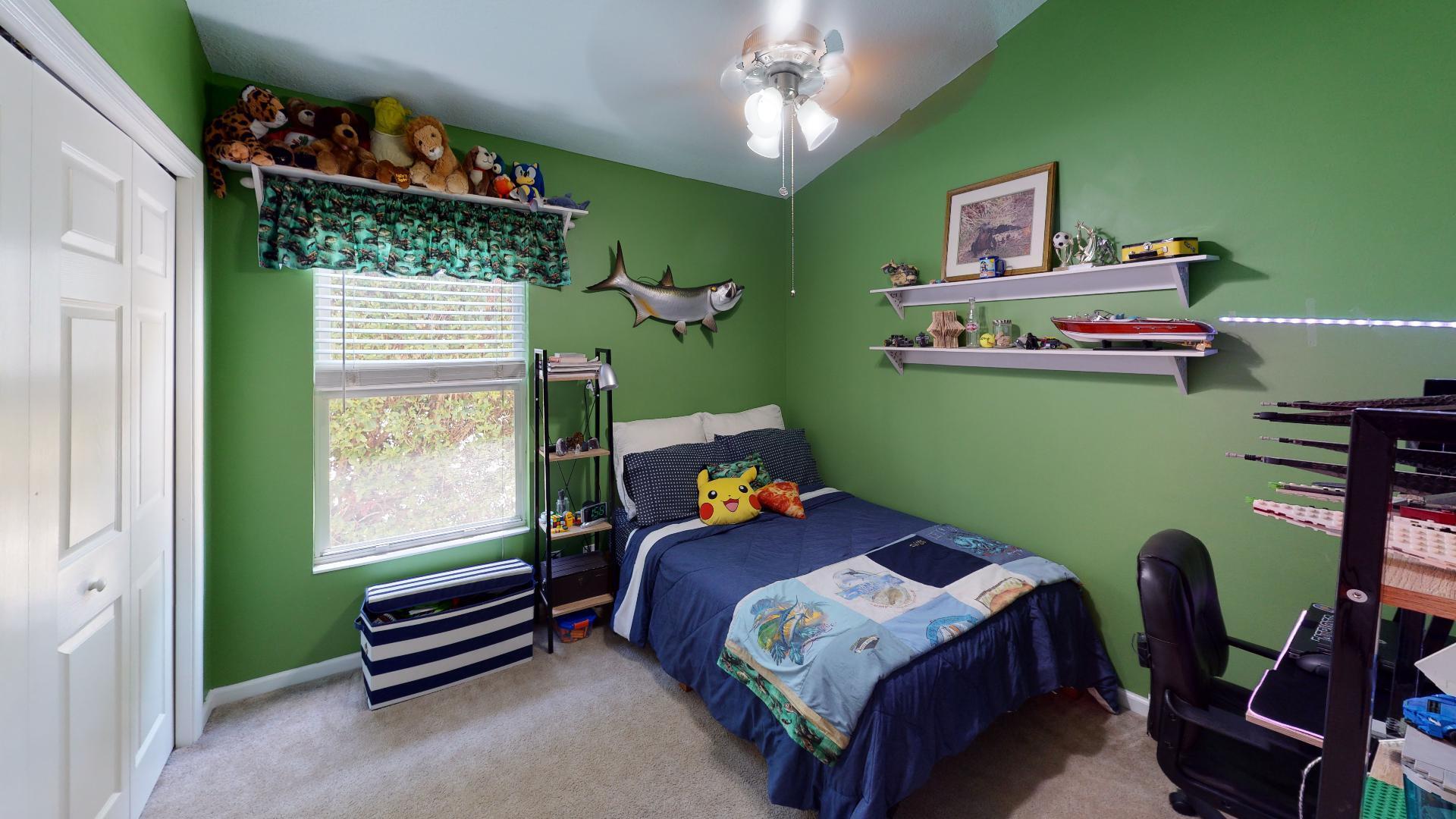 150 Sunshine Boulevard Tavernier, FL 33070 - Photo 15 of 26 a bedroom with a bed and windows