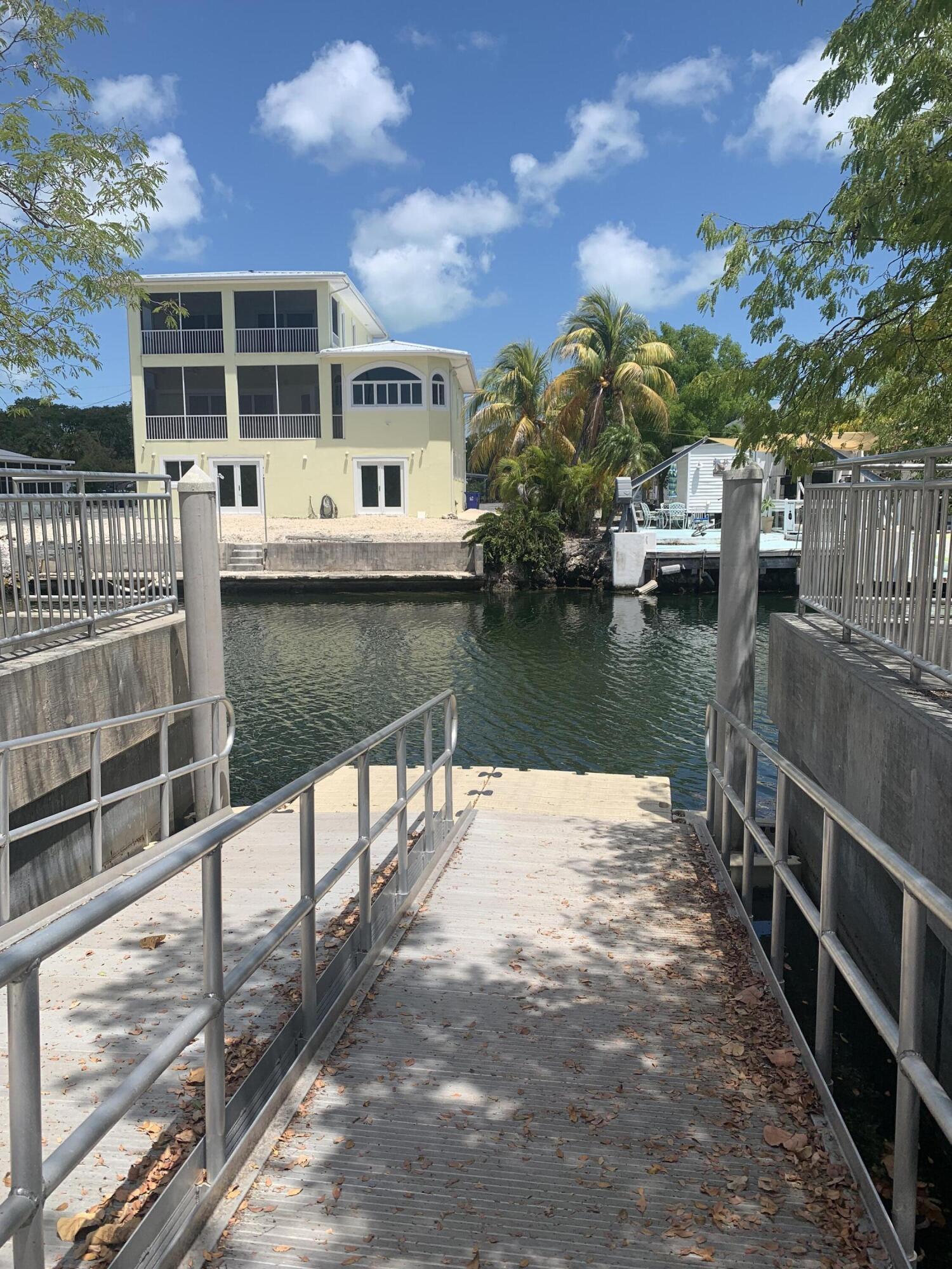 150 Sunshine Boulevard Tavernier, FL 33070 - Photo 18 of 26 a view of a lake with a house