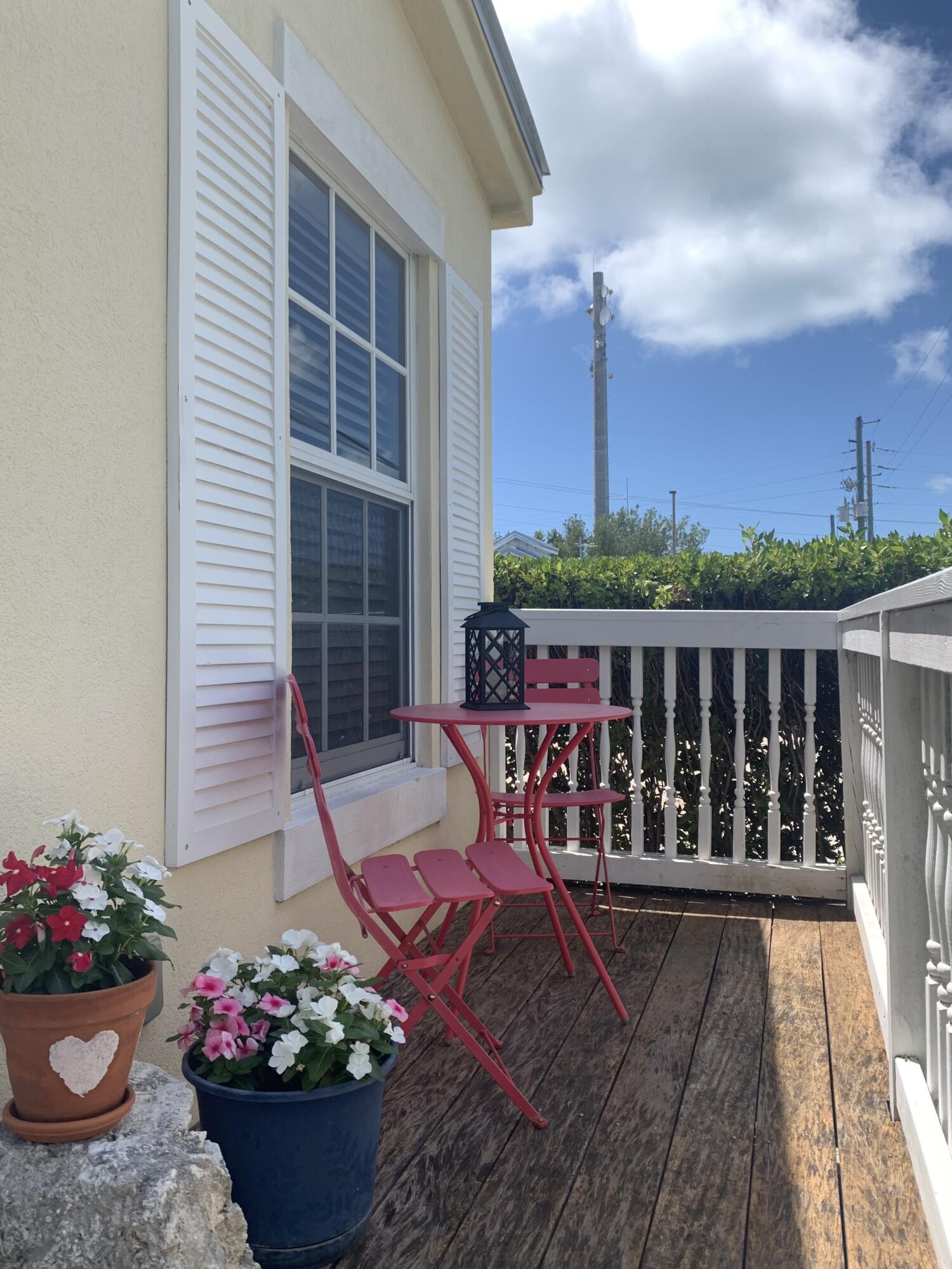 150 Sunshine Boulevard Tavernier, FL 33070 - Photo 25 of 26 a view of a chair and table on the wooden floor