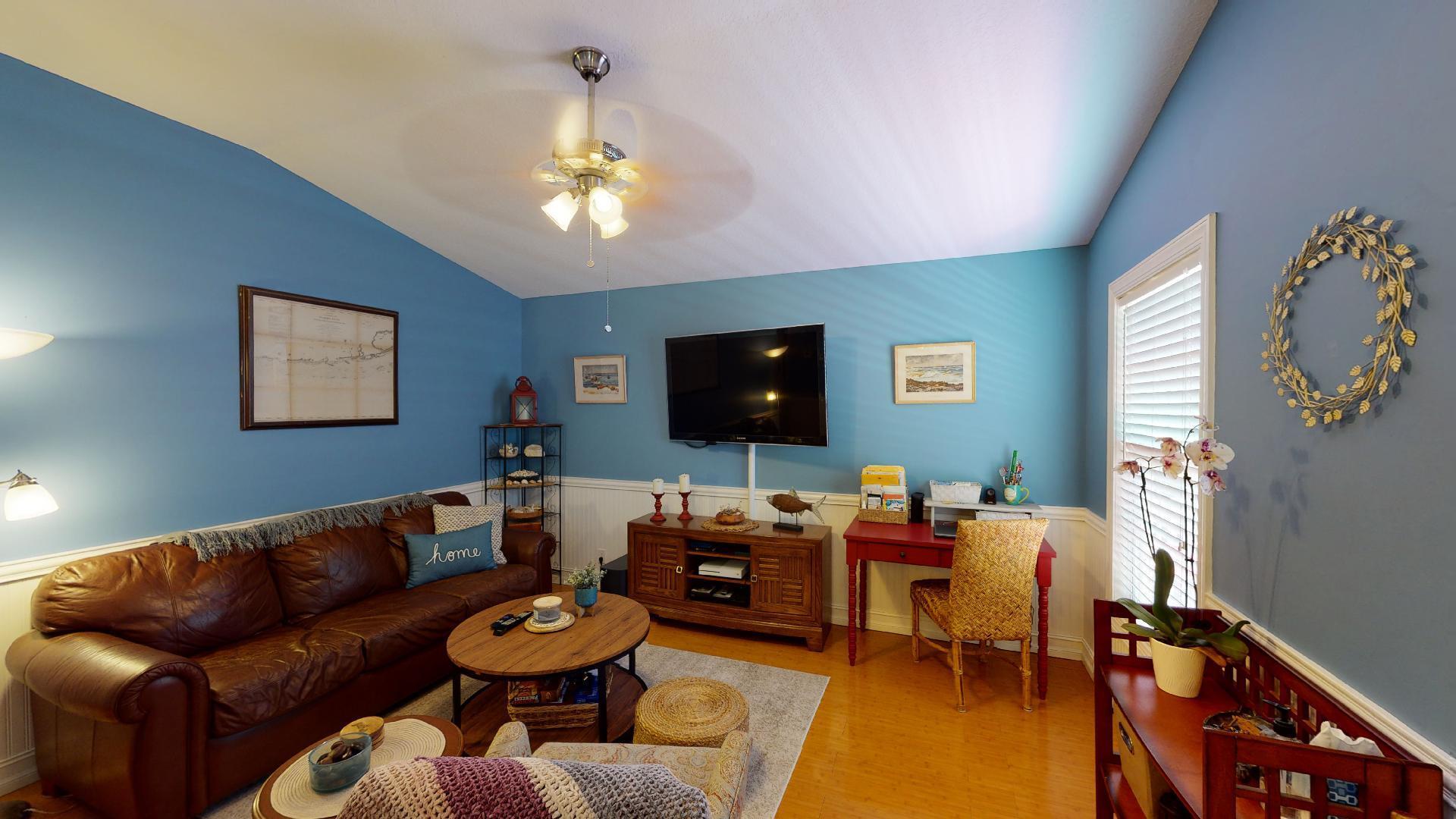 150 Sunshine Boulevard Tavernier, FL 33070 - Photo 3 of 26 a living room with furniture and a flat screen tv