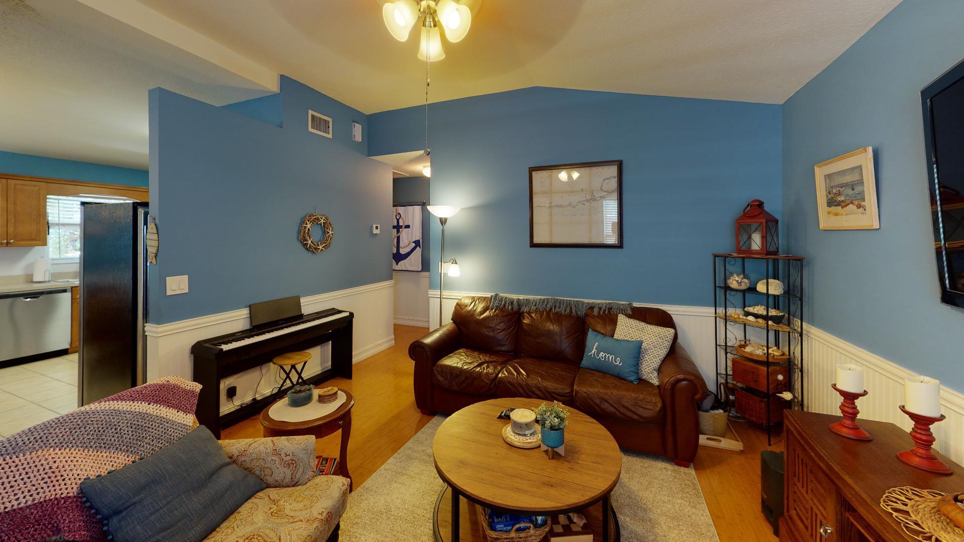 150 Sunshine Boulevard Tavernier, FL 33070 - Photo 4 of 26 a living room with furniture and a wooden floor