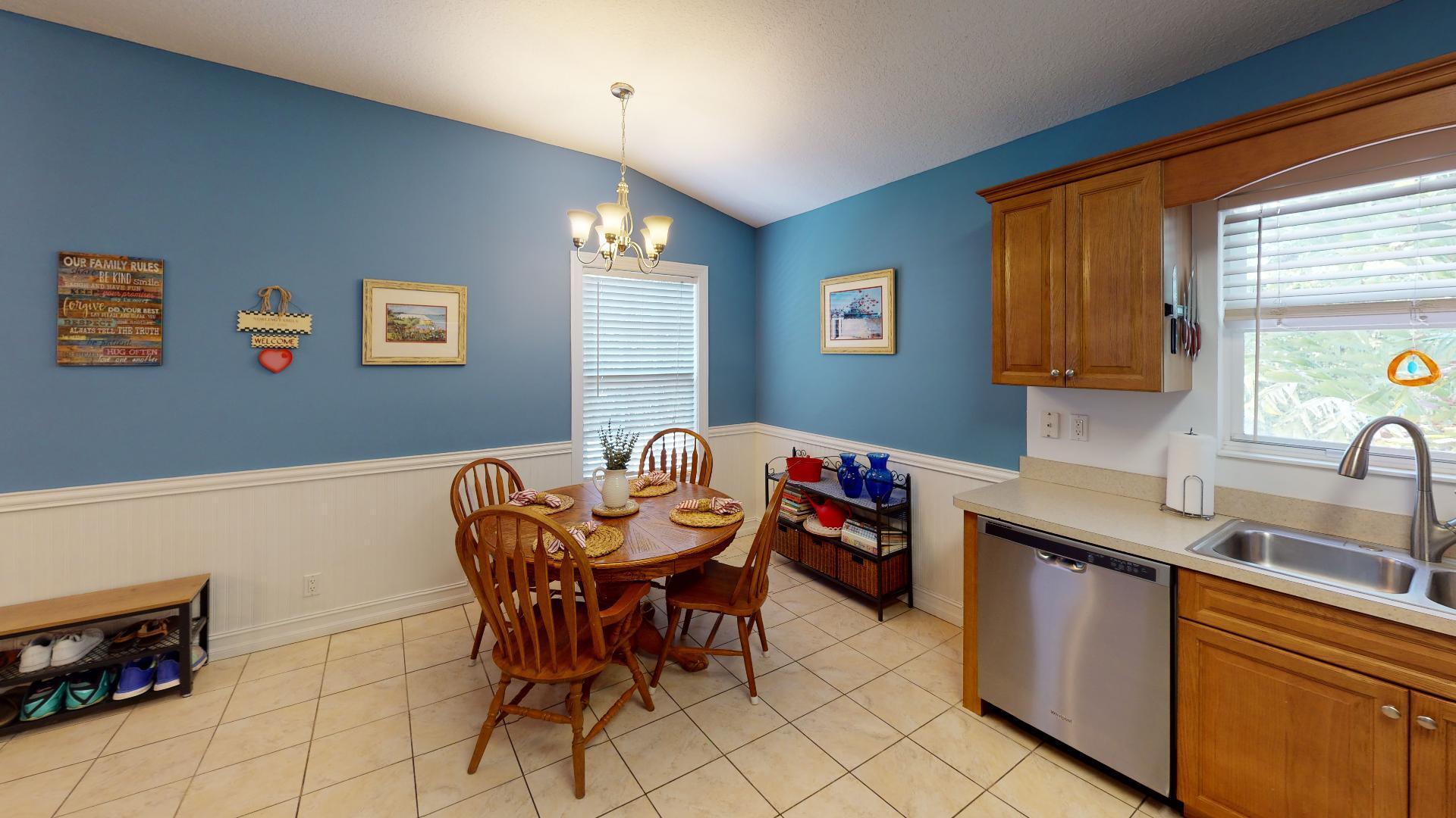 150 Sunshine Boulevard Tavernier, FL 33070 - Photo 6 of 26 a view of a kitchen area with furniture and window
