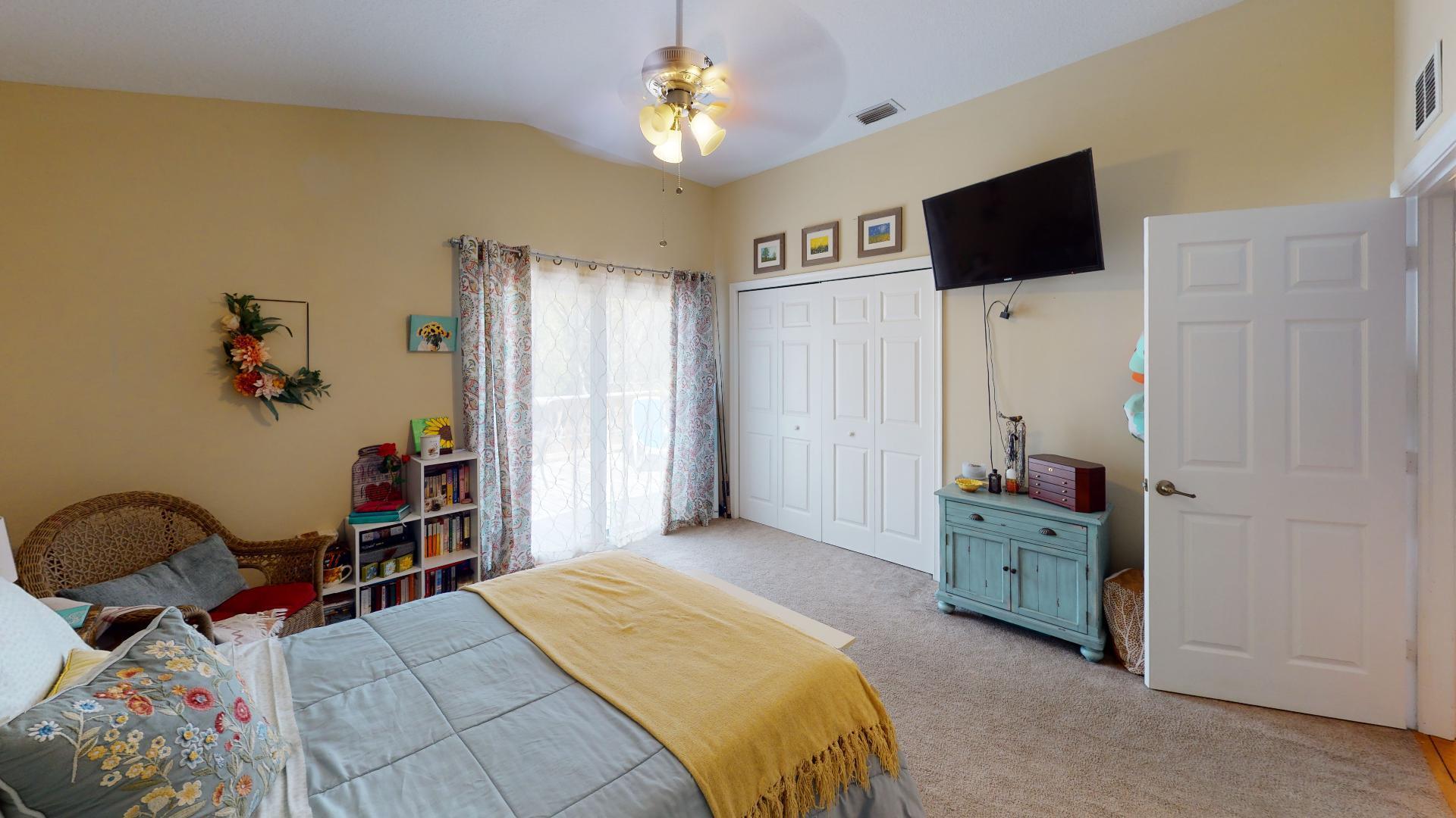150 Sunshine Boulevard Tavernier, FL 33070 - Photo 9 of 26 a bedroom with a bed and a flat screen tv
