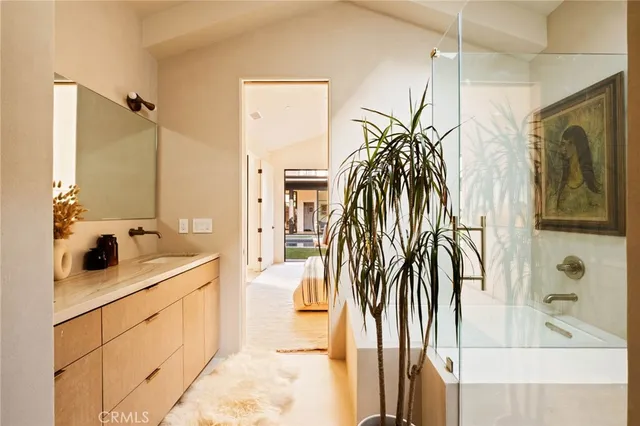 a bathroom with a shower and a sink
