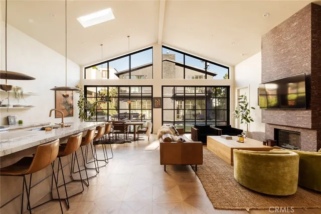 a living room with fireplace furniture and a flat screen tv