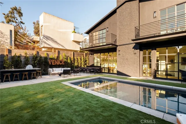 a view of a swimming pool with a patio