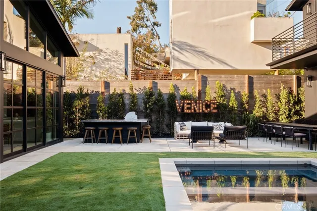 a view of outdoor sitting area with furniture