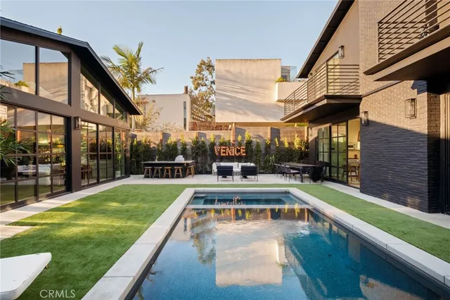 a view of a swimming pool with a patio
